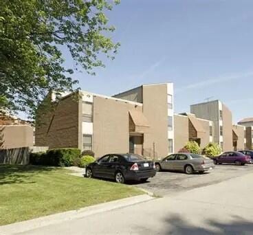 25 Dickinson St Unit G, Mount Clemens, MI 48043 - view of property with uncovered parking