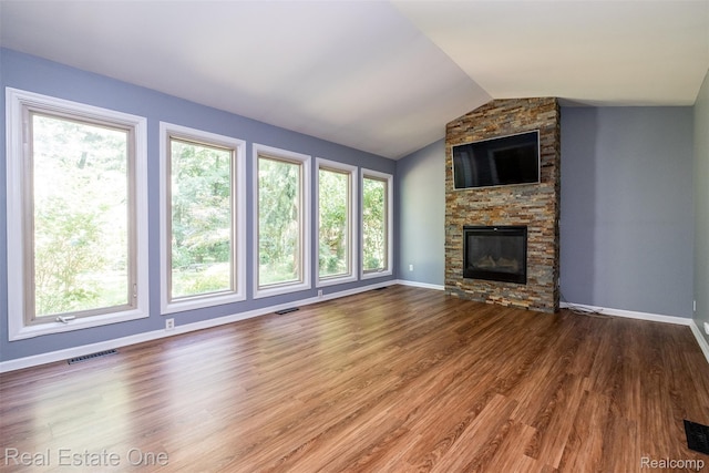 4079 Cumberland Ct, Commerce Twp, MI 48390 - unfurnished living room with wood finished floors, vaulted ceiling, and a fireplace