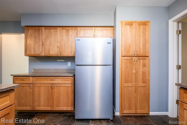 4079 Cumberland Ct, Commerce Twp, MI 48390 - kitchen with freestanding refrigerator and stone countertops