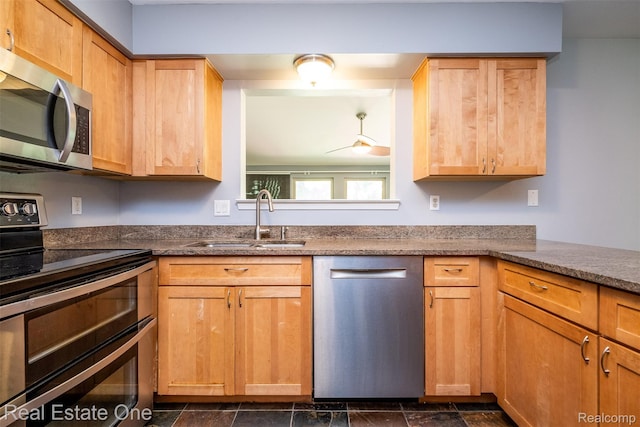 4079 Cumberland Ct, Commerce Twp, MI 48390 - kitchen featuring appliances with stainless steel finishes and dark stone finish flooring