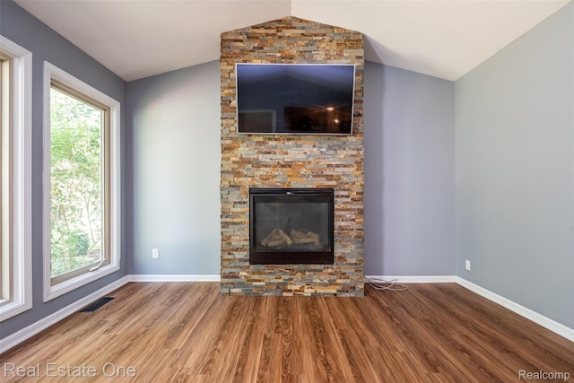 4079 Cumberland Ct, Commerce Twp, MI 48390 - unfurnished living room featuring lofted ceiling and wood finished floors