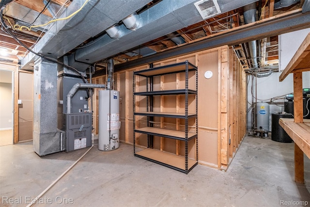 4079 Cumberland Ct, Commerce Twp, MI 48390 - unfinished below grade area featuring water heater, heating unit, and a water pressure tank
