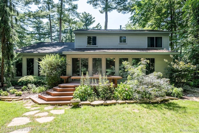 4079 Cumberland Ct, Commerce Twp, MI 48390 - back of house featuring a lawn and a wooden deck