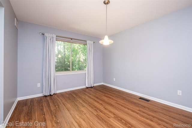4079 Cumberland Ct, Commerce Twp, MI 48390 - unfurnished room featuring wood finished floors and baseboards