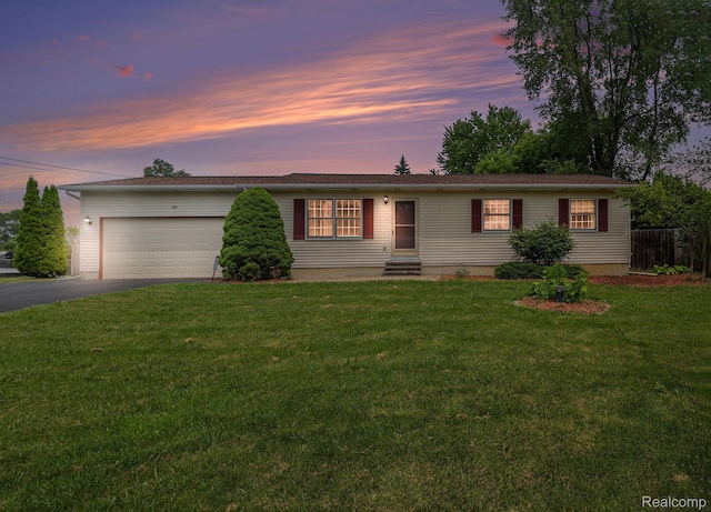 5511 Wakefield Rd, Grand Blanc, MI 48439 - ranch-style home with driveway, an attached garage, and entry steps