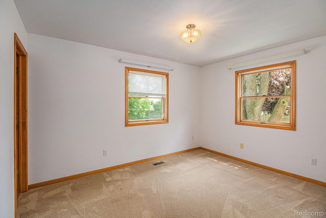 5511 Wakefield Rd, Grand Blanc, MI 48439 - empty room with healthy amount of natural light and light colored carpet