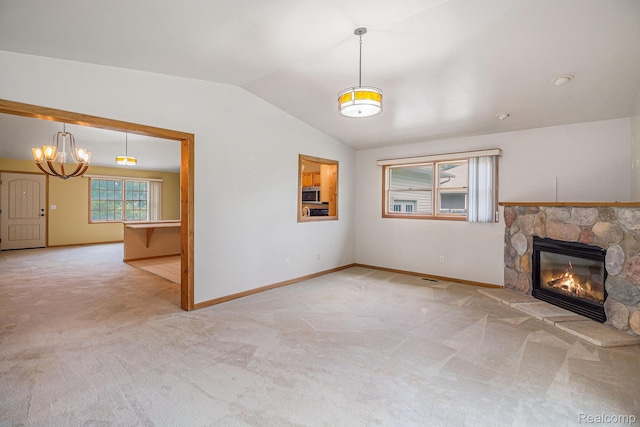 5511 Wakefield Rd, Grand Blanc, MI 48439 - unfurnished living room with carpet, a stone fireplace, lofted ceiling, and a chandelier