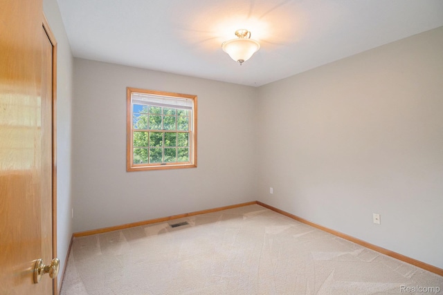 5511 Wakefield Rd, Grand Blanc, MI 48439 - spare room featuring baseboards and light colored carpet