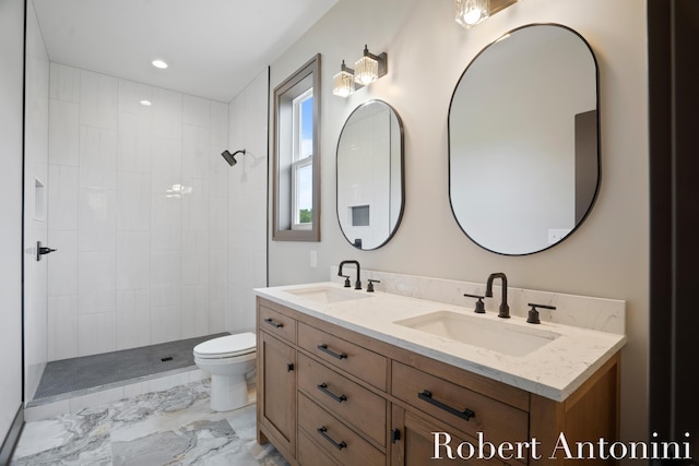 6691 Egan Ave SE, Caledonia, MI 49316 - bathroom with double vanity, marble finish floors, a tile shower, and recessed lighting