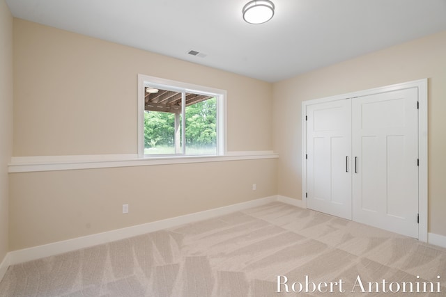 6691 Egan Ave SE, Caledonia, MI 49316 - unfurnished bedroom featuring carpet floors and a closet
