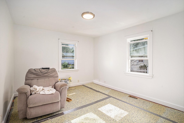 2559 Miner Ave, Muskegon, MI 49441 - living area featuring baseboards and speckle patterned floor