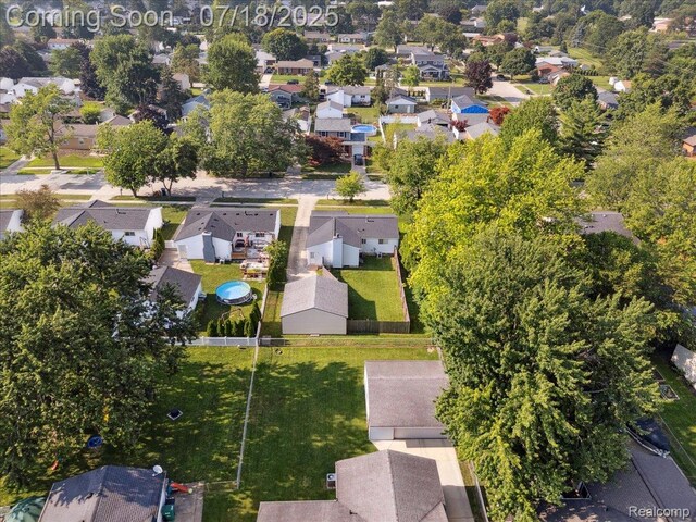 321 Harvard Ave, South Lyon, MI 48178 - aerial view of property and surrounding area with nearby suburban area