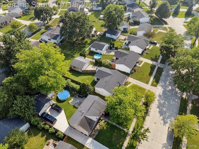 321 Harvard Ave, South Lyon, MI 48178 - aerial overview of property's location with nearby suburban area
