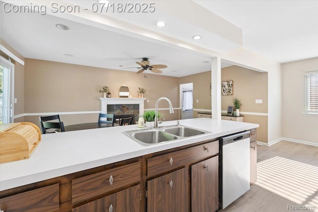 321 Harvard Ave, South Lyon, MI 48178 - kitchen featuring stainless steel dishwasher, plenty of natural light, light wood-style floors, light countertops, and recessed lighting