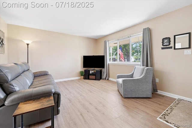321 Harvard Ave, South Lyon, MI 48178 - living area with wood finished floors and baseboards