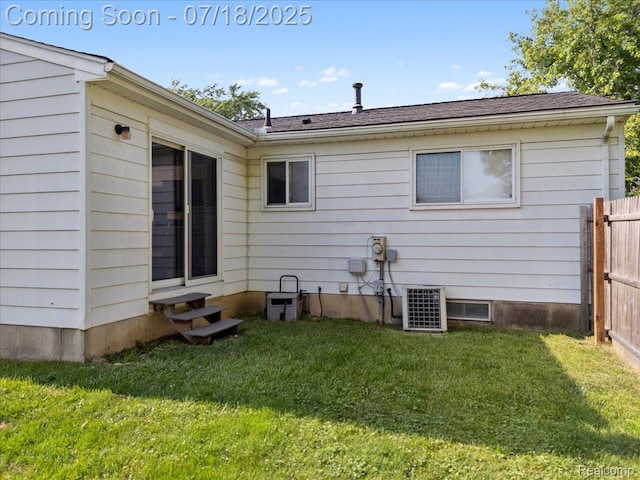 321 Harvard Ave, South Lyon, MI 48178 - back of property with entry steps and roof with shingles