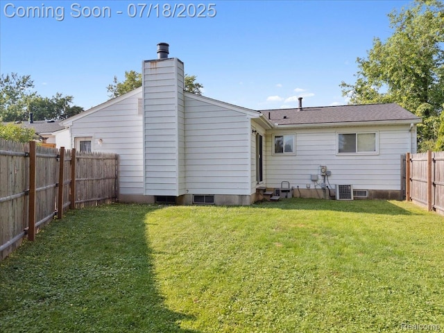 321 Harvard Ave, South Lyon, MI 48178 - rear view of house featuring a fenced backyard and a chimney