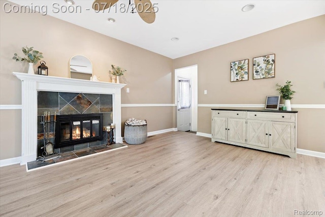 321 Harvard Ave, South Lyon, MI 48178 - living room with light wood-style flooring and a tiled fireplace