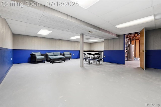 321 Harvard Ave, South Lyon, MI 48178 - living room with a drop ceiling, finished concrete floors, and gas water heater