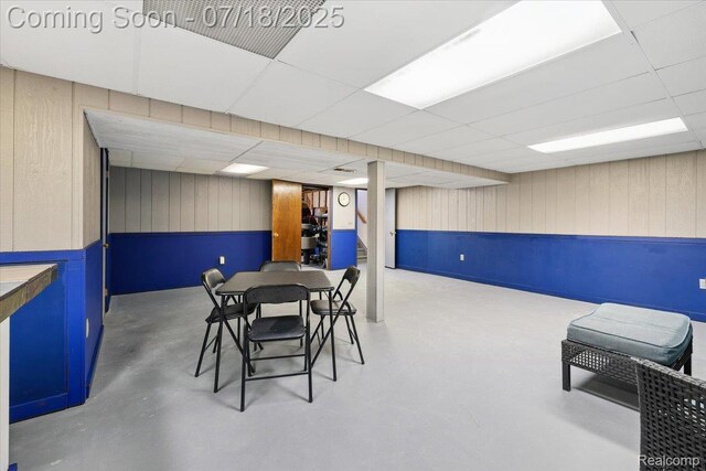 321 Harvard Ave, South Lyon, MI 48178 - dining space with wood walls and a paneled ceiling