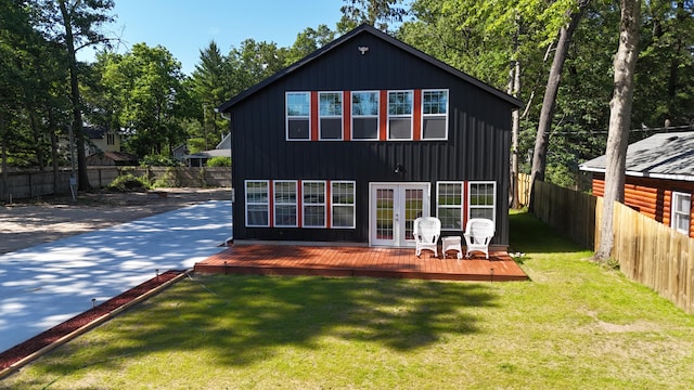17016 6th St, Wellston, MI 49689 - rear view of property with french doors and a deck