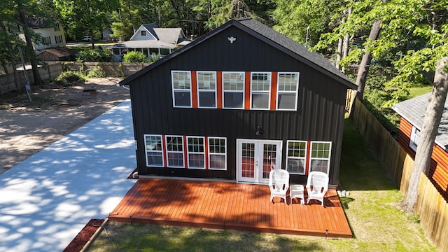 17016 6th St, Wellston, MI 49689 - back of property with french doors, a wooden deck, and a fenced backyard
