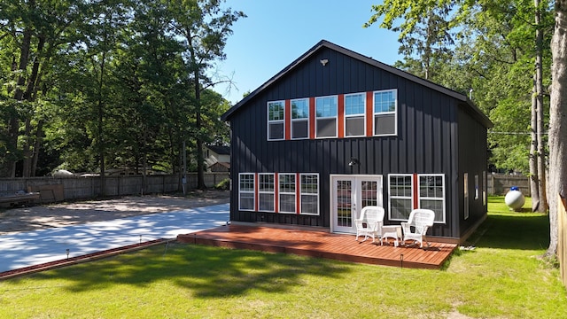 17016 6th St, Wellston, MI 49689 - rear view of property with a deck and board and batten siding