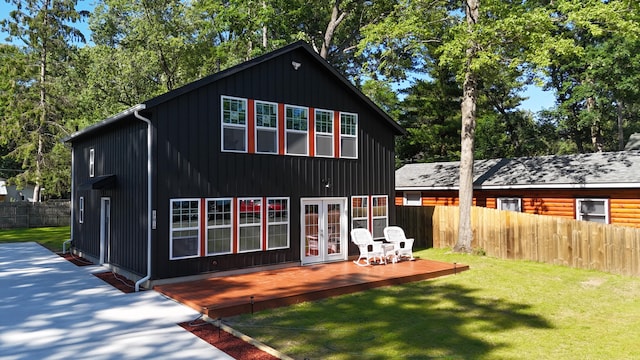 17016 6th St, Wellston, MI 49689 - rear view of property featuring french doors and a deck