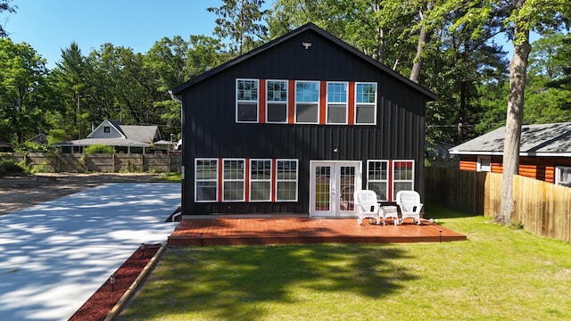 17016 6th St, Wellston, MI 49689 - back of house with french doors and a deck
