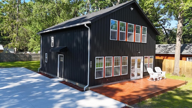 17016 6th St, Wellston, MI 49689 - back of property with french doors, a wooden deck, and a patio area