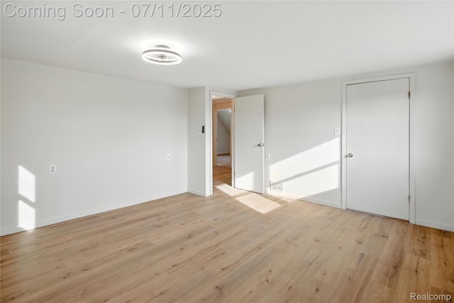 420 Wellsboro St, Walled Lake, MI 48390 - empty room with light wood-style flooring and baseboards