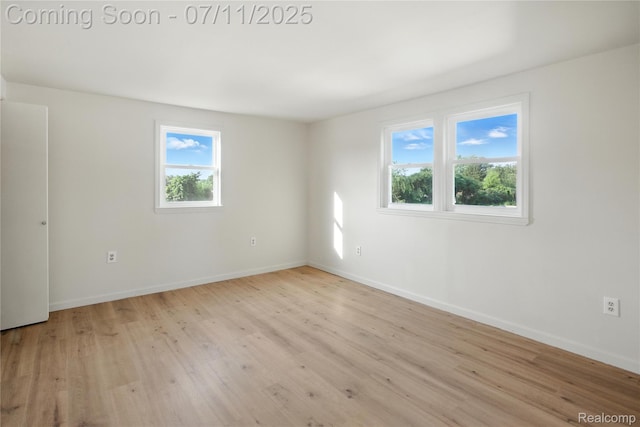 420 Wellsboro St, Walled Lake, MI 48390 - unfurnished room with light wood finished floors and baseboards