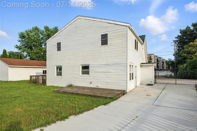 420 Wellsboro St, Walled Lake, MI 48390 - view of side of home with a patio area