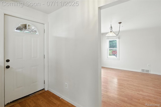 420 Wellsboro St, Walled Lake, MI 48390 - entrance foyer with wood finished floors and baseboards