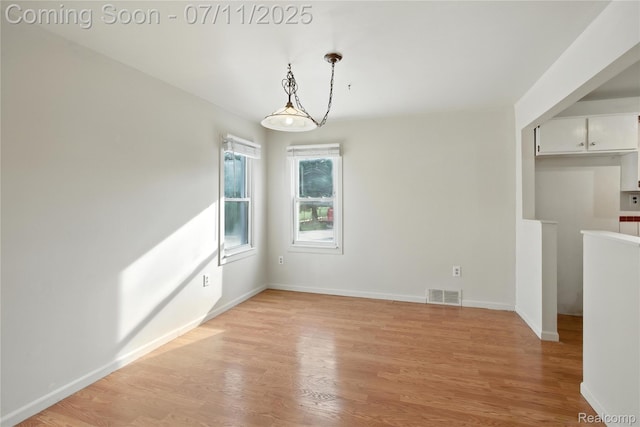 420 Wellsboro St, Walled Lake, MI 48390 - unfurnished dining area with light wood finished floors
