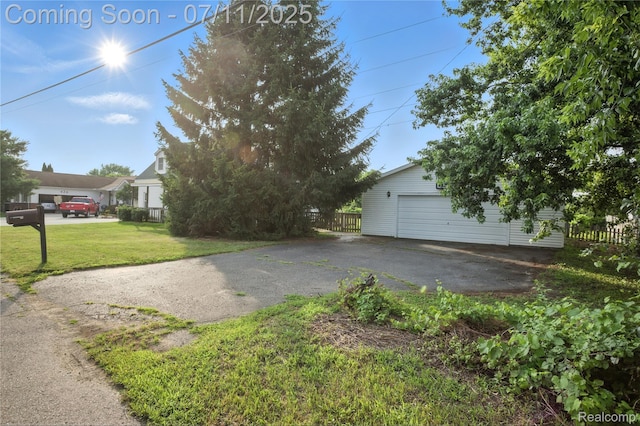 420 Wellsboro St, Walled Lake, MI 48390 - view of side of property with an outbuilding and a garage