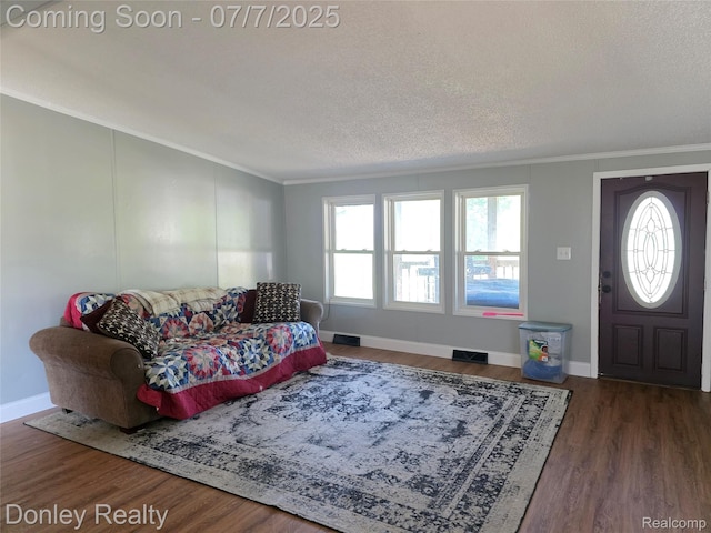 4605 Pleasant St, Clifford, MI 48727 - living area with crown molding, wood finished floors, and a textured ceiling