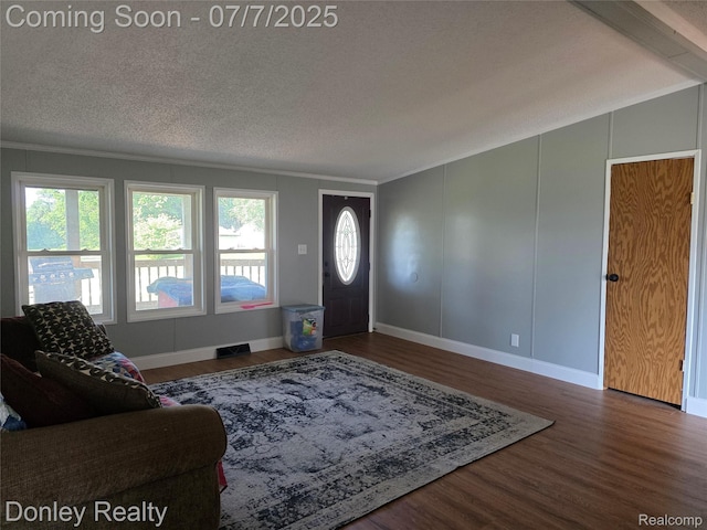 4605 Pleasant St, Clifford, MI 48727 - entrance foyer with healthy amount of natural light, wood finished floors, a textured ceiling, and crown molding