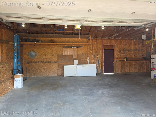4605 Pleasant St, Clifford, MI 48727 - garage featuring refrigerator