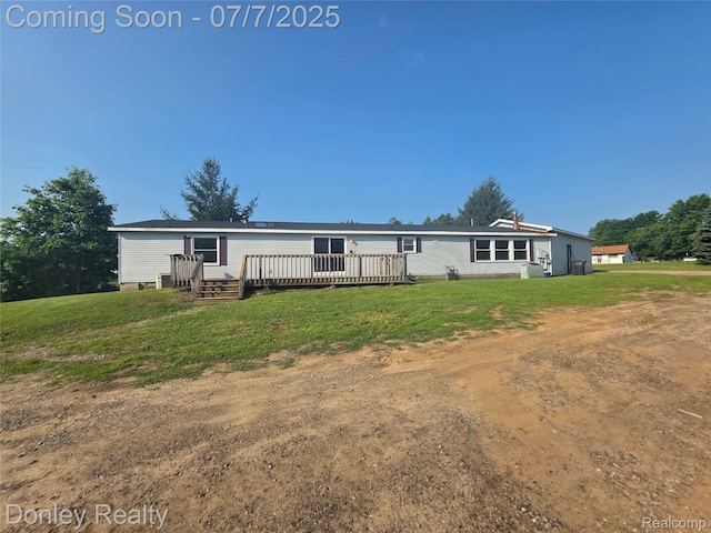4605 Pleasant St, Clifford, MI 48727 - rear view of property featuring a deck and a lawn