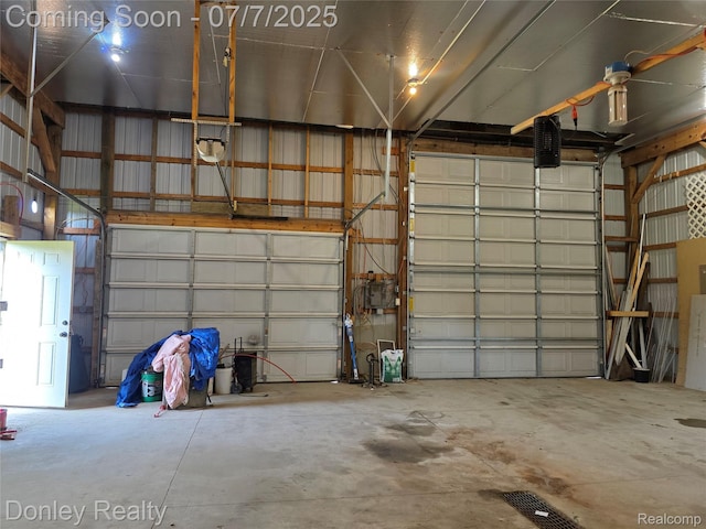 4605 Pleasant St, Clifford, MI 48727 - garage featuring a garage door opener