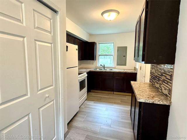 35209 Sheridan Ave, Westland, MI 48185 - kitchen with white appliances, dark brown cabinets, tasteful backsplash, light countertops, and electric panel