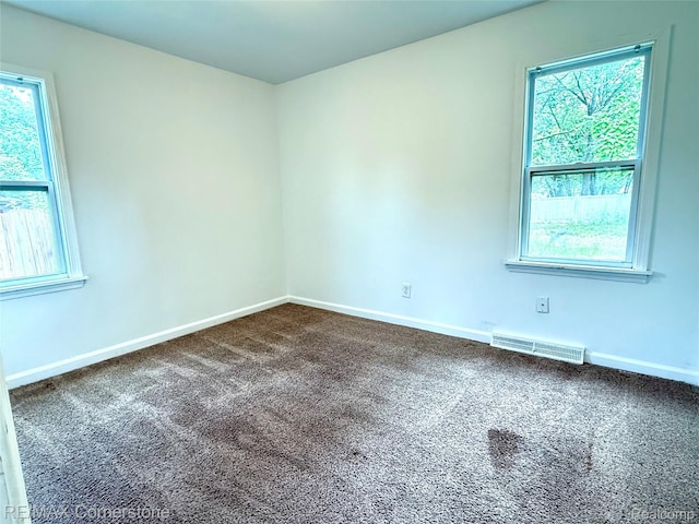 35209 Sheridan Ave, Westland, MI 48185 - unfurnished room with dark carpet and healthy amount of natural light