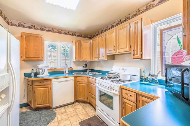 927 Kensington Ave, Flint, MI 48503 - kitchen with white appliances and light stone finish floors