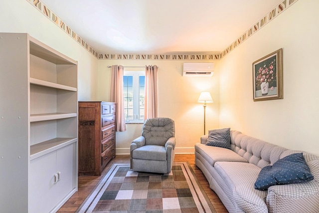 927 Kensington Ave, Flint, MI 48503 - living room featuring a wall unit AC and dark wood-type flooring