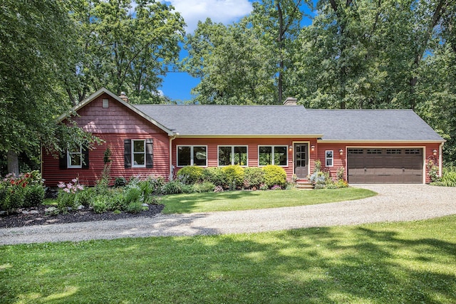 14814 Stone Jug Rd, Battle Creek, MI 49015 - ranch-style house featuring a garage, driveway, a front yard, a chimney, and a shingled roof