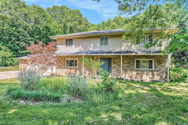 8257 S 2nd St, Michigan, MI 49071 - traditional-style home featuring brick siding and a front yard