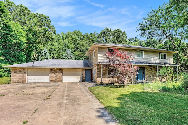 8257 S 2nd St, Michigan, MI 49071 - traditional-style house featuring driveway, a front lawn, a garage, and brick siding