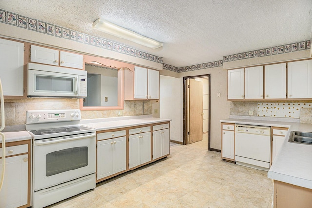 8257 S 2nd St, Michigan, MI 49071 - kitchen with white appliances, a textured ceiling, light countertops, light flooring, and decorative backsplash