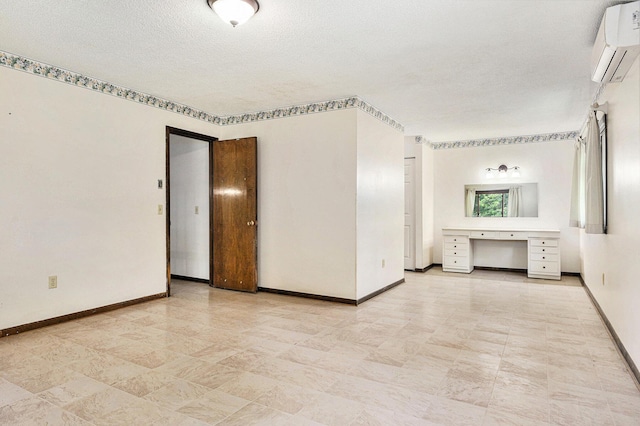 8257 S 2nd St, Michigan, MI 49071 - empty room featuring a wall mounted AC, a textured ceiling, and an office area